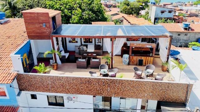 an aerial view of a house with a roof at Residence Pipa Beach in Pipa