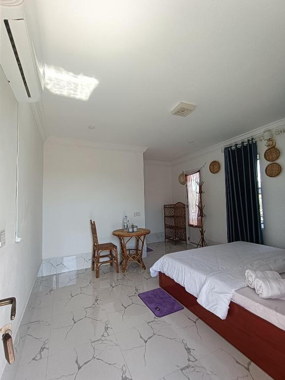 Postel nebo postele na pokoji v ubytování El Ling guesthouse