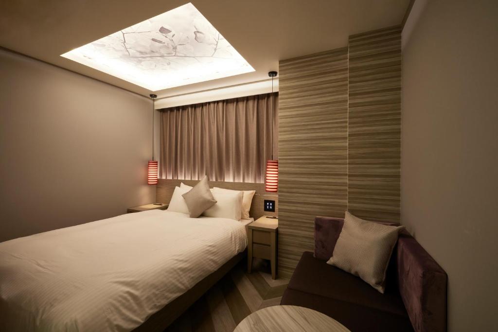 Postel nebo postele na pokoji v ubytování ALFIT HOTEL & BAR AKASAKA