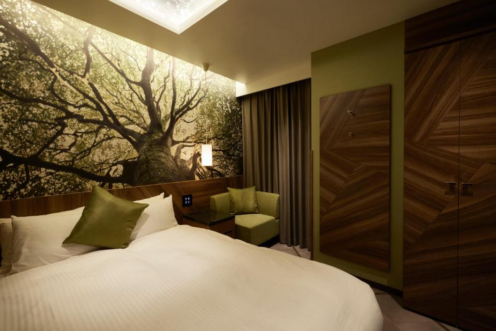 Postel nebo postele na pokoji v ubytování ALFIT HOTEL & BAR AKASAKA
