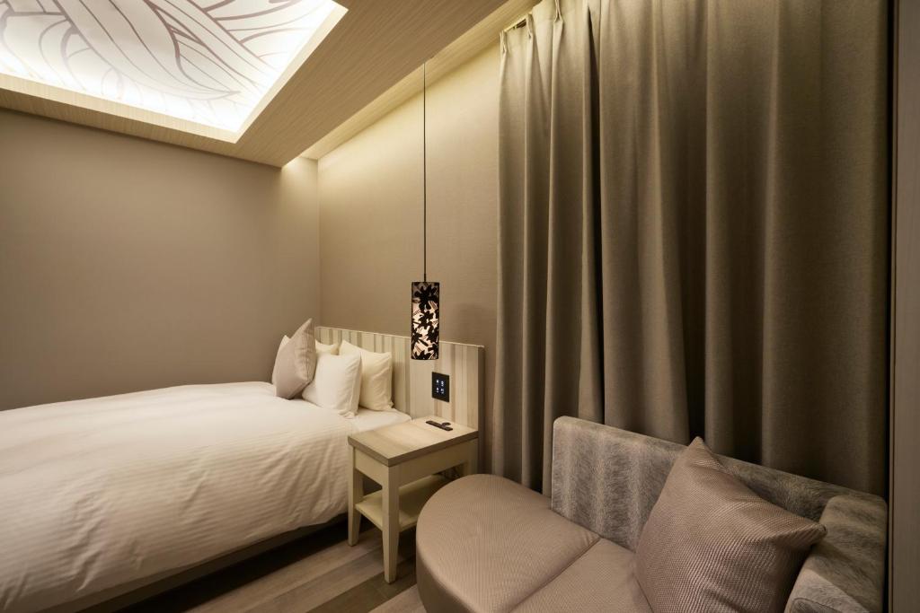 Postel nebo postele na pokoji v ubytování ALFIT HOTEL & BAR AKASAKA