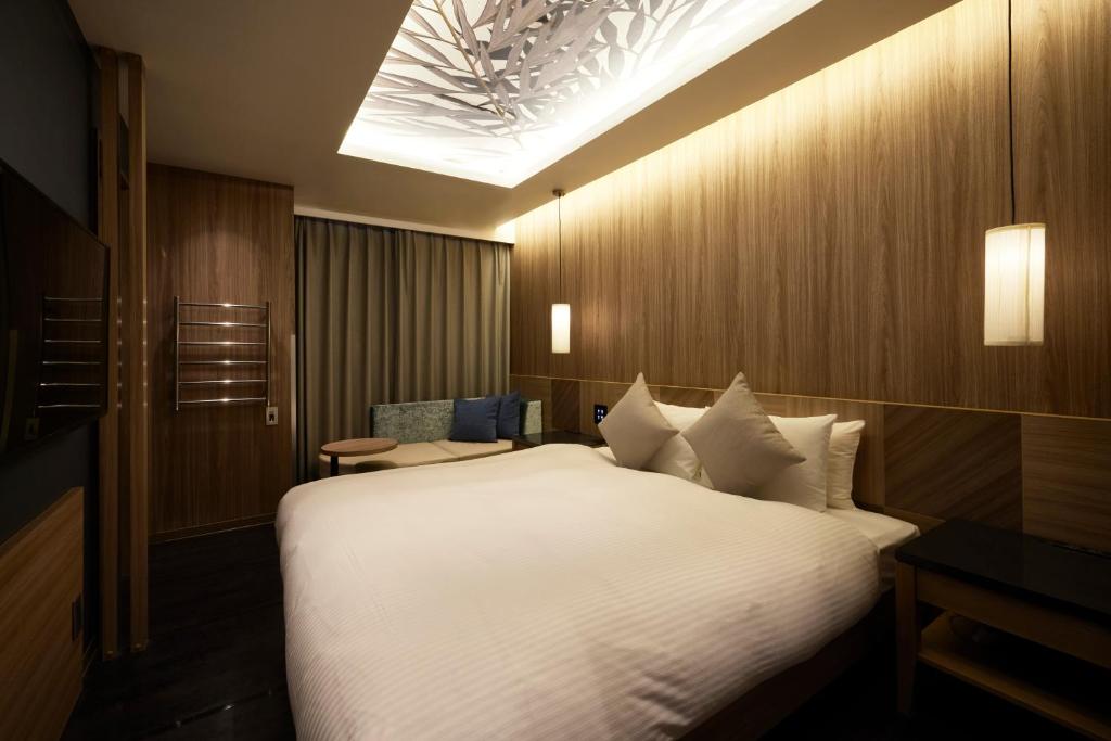 Postel nebo postele na pokoji v ubytování ALFIT HOTEL & BAR AKASAKA