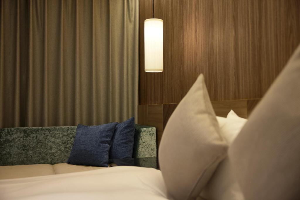 Postel nebo postele na pokoji v ubytování ALFIT HOTEL & BAR AKASAKA