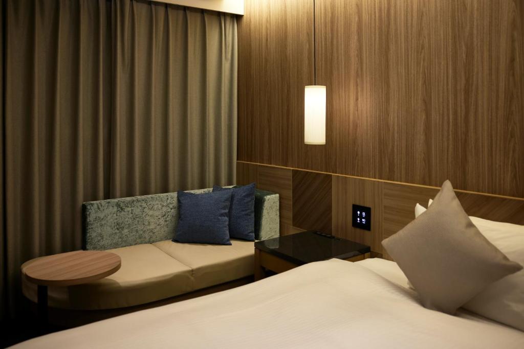 Postel nebo postele na pokoji v ubytování ALFIT HOTEL & BAR AKASAKA