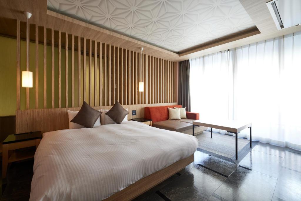 Postel nebo postele na pokoji v ubytování ALFIT HOTEL & BAR AKASAKA