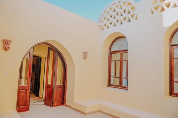 a room with two doors and two windows at قرية تونس in Tunis