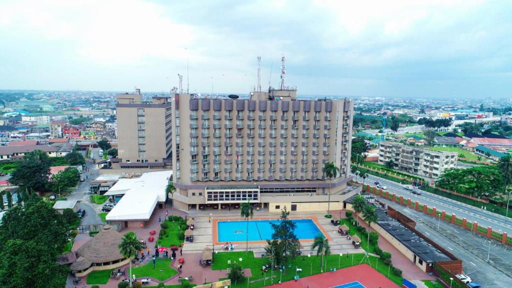 an overhead view of a large building with a pool at Hotel Presidential in Port Harcourt