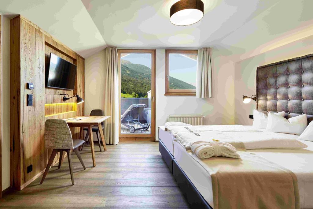 Posteľ alebo postele v izbe v ubytovaní Dolomiten Residenz - Sporthotel Sillian