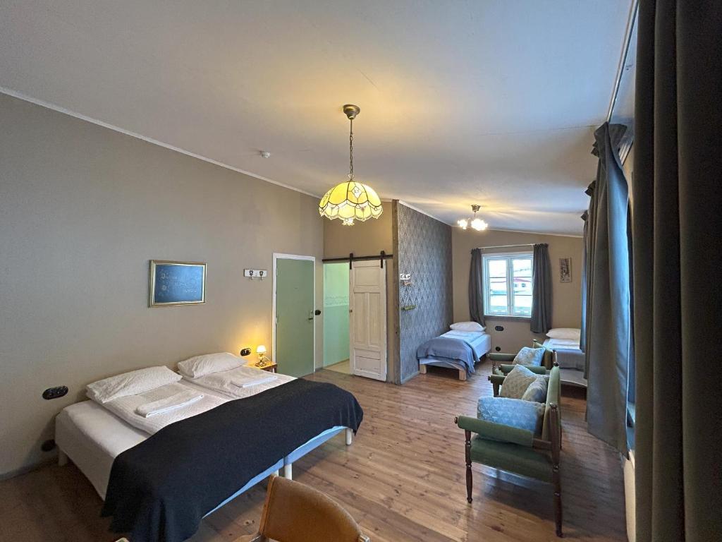 a hotel room with a bed and a couch at Wilderness Center / Óbyggðasetur Íslands in Óbyggðasetur