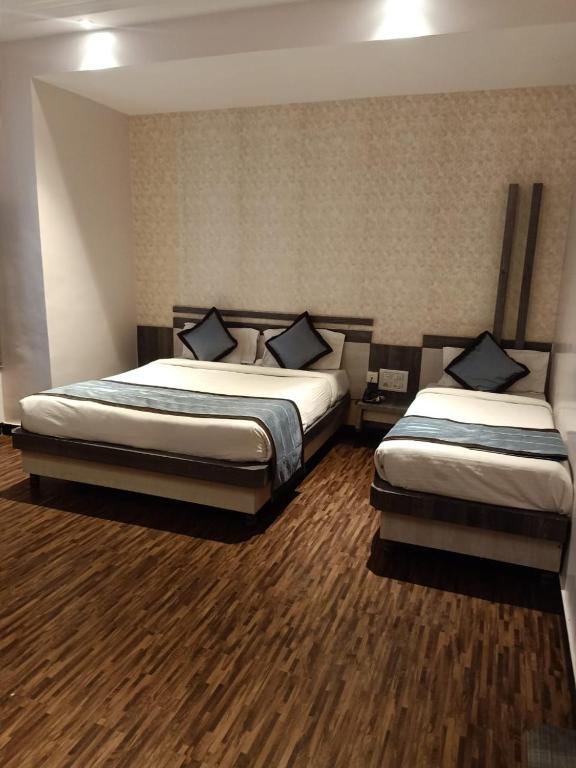 Postel nebo postele na pokoji v ubytování Hotel Kiara Eshosans Palace