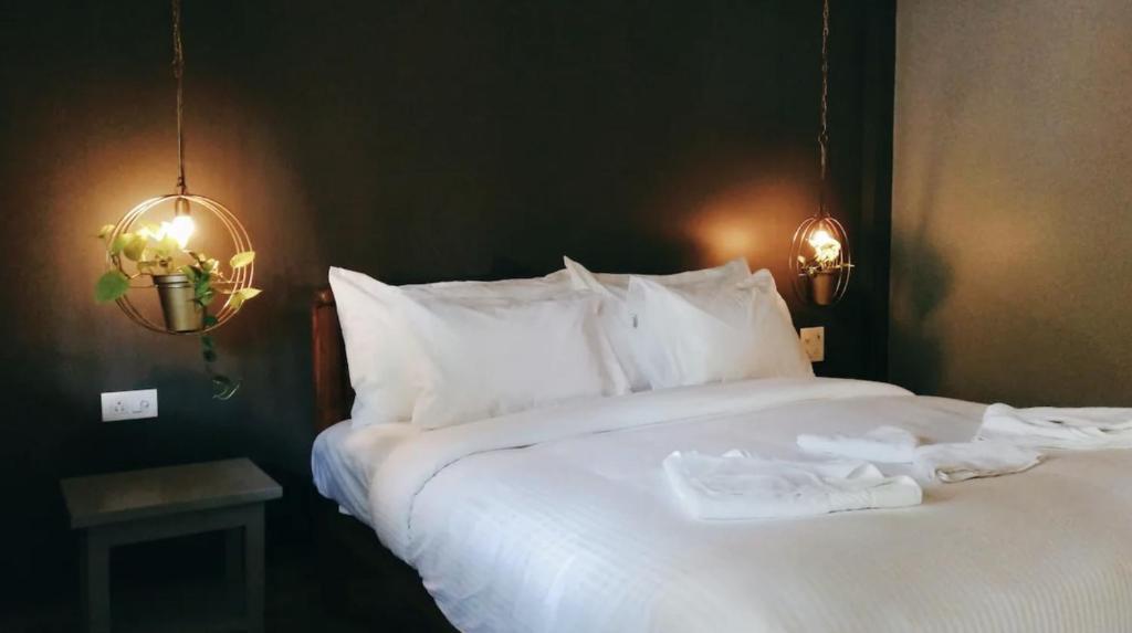 Postel nebo postele na pokoji v ubytování Tien B&B & Bistro