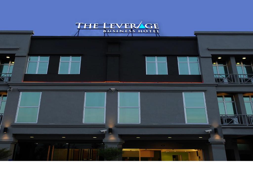 a black building with a sign on top of it at The Leverage Lite Hotel - Kuala Kedah in Alor Setar