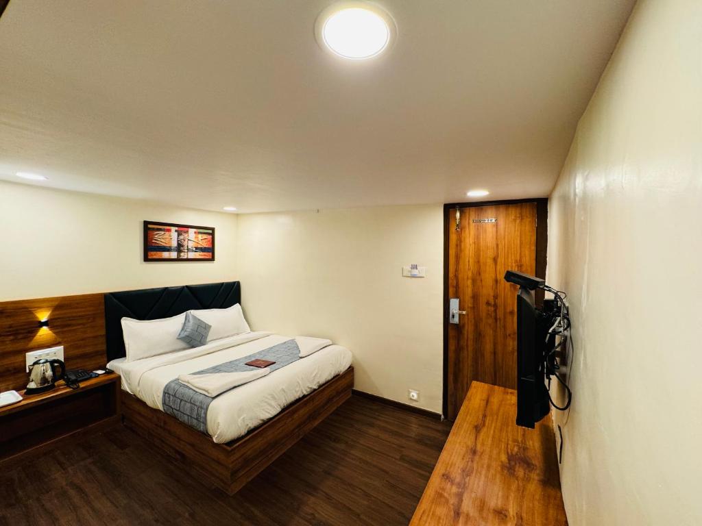 Postel nebo postele na pokoji v ubytování Hotel Aksa Palace