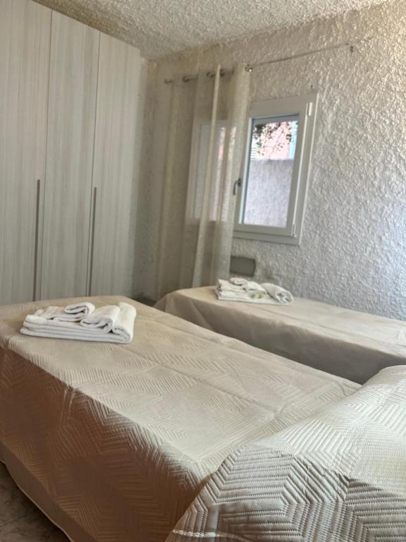 Postel nebo postele na pokoji v ubytování Li Pintaderi