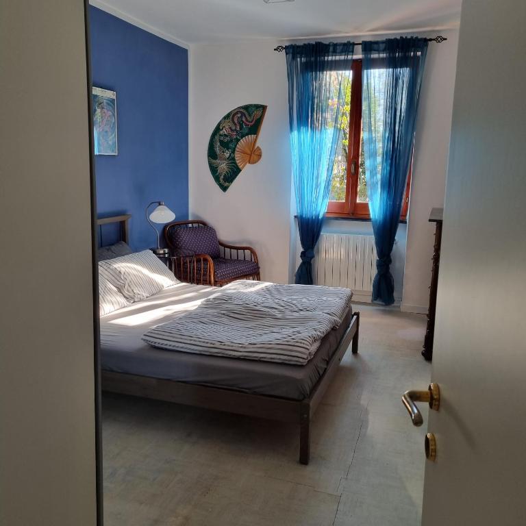 Postel nebo postele na pokoji v ubytování B&B La Terrazza Sui Fieschi