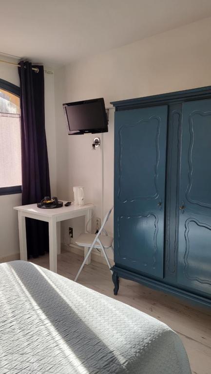 Postel nebo postele na pokoji v ubytování Auberge de la Table Ronde
