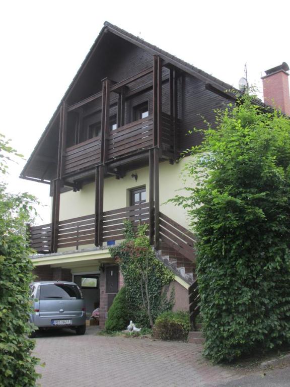 a house with a car parked in front of it at Dum Eva in Janske Lazne