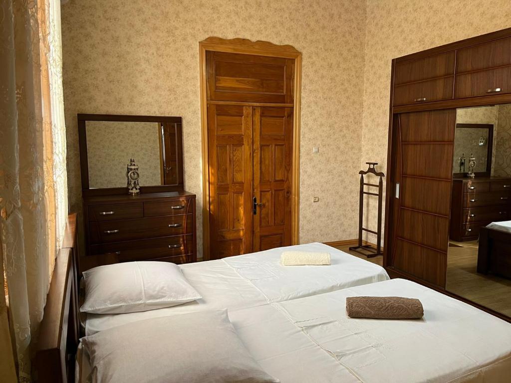 Postel nebo postele na pokoji v ubytování Guest House Levan II Dadiani