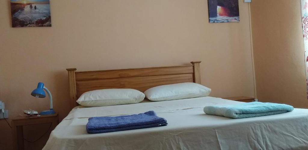 Postel nebo postele na pokoji v ubytování Flamengo