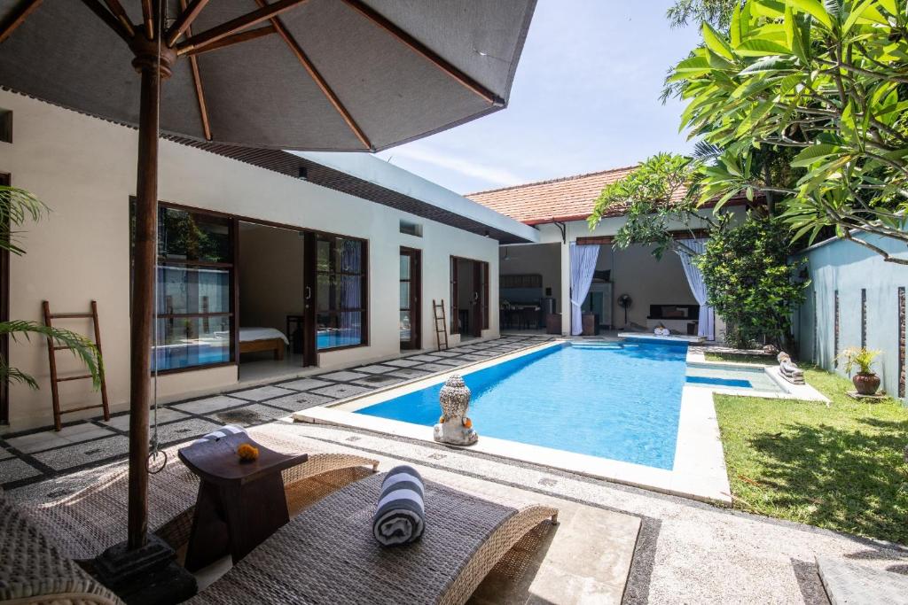 an image of a swimming pool in a villa at Enigma Villa Canggu in Canggu