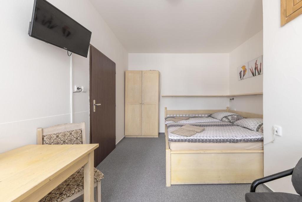Postel nebo postele na pokoji v ubytování Hotel Pivovar Polička
