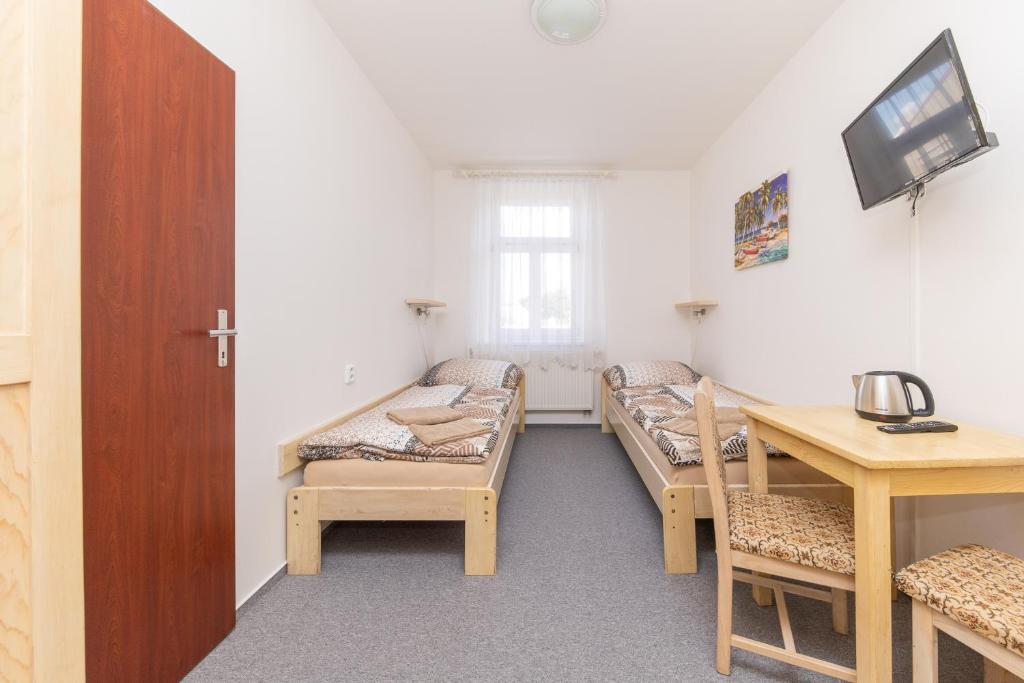 Postel nebo postele na pokoji v ubytování Hotel Pivovar Polička