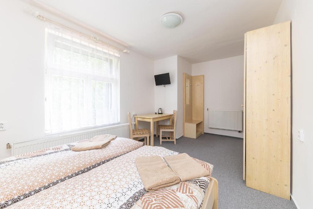 Postel nebo postele na pokoji v ubytování Hotel Pivovar Polička