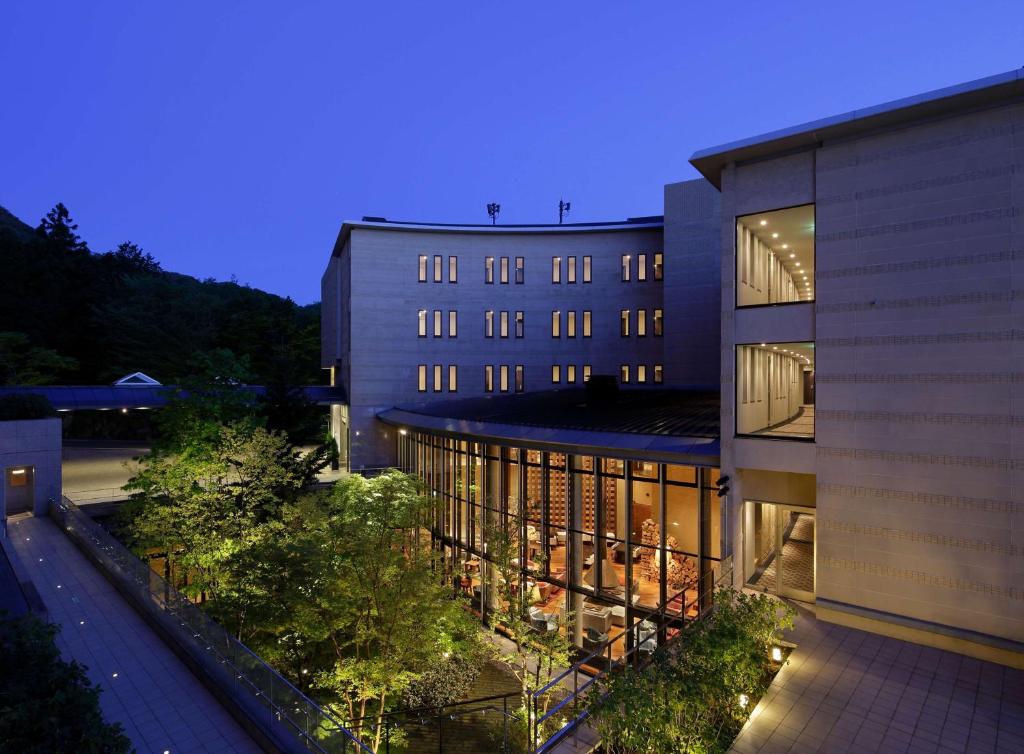 a large building with lights in front of it at Hyatt Regency Hakone Resort and Spa in Hakone