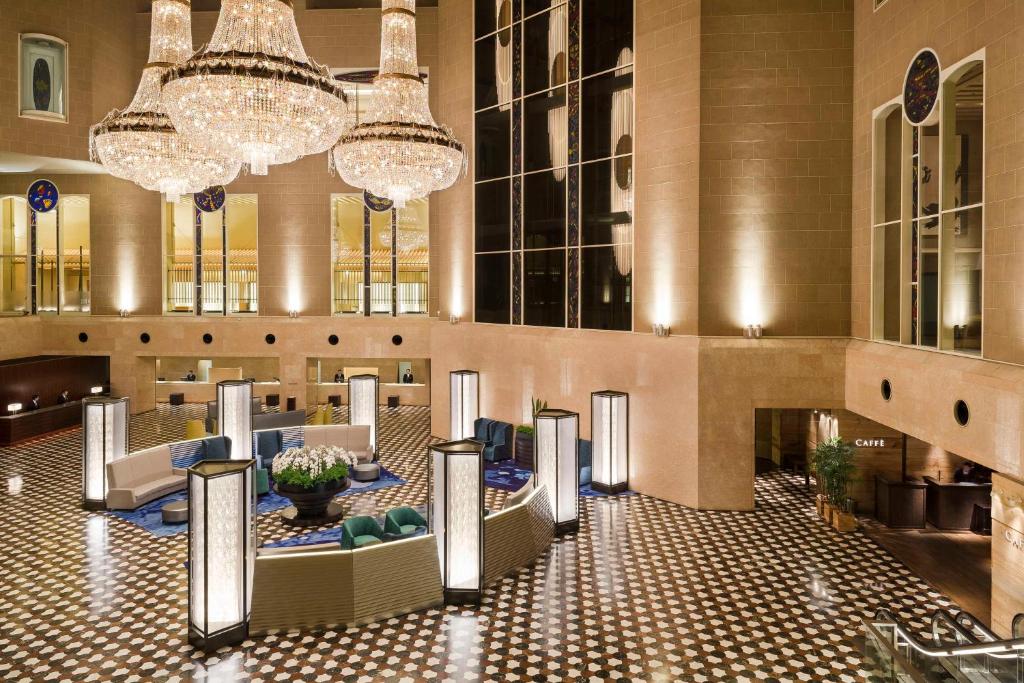 a lobby of a hotel with chandeliers at Hyatt Regency Tokyo in Tokyo
