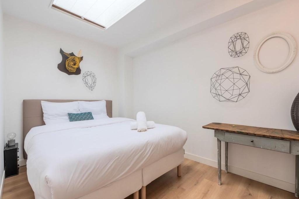 Posteľ alebo postele v izbe v ubytovaní Appartement lumineux avec rooftop et garage privé.