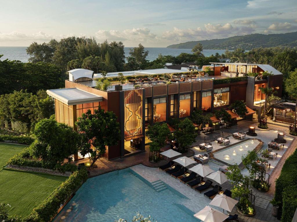 an aerial view of a resort with a swimming pool at Avista Grande Phuket Karon - MGallery in Karon Beach