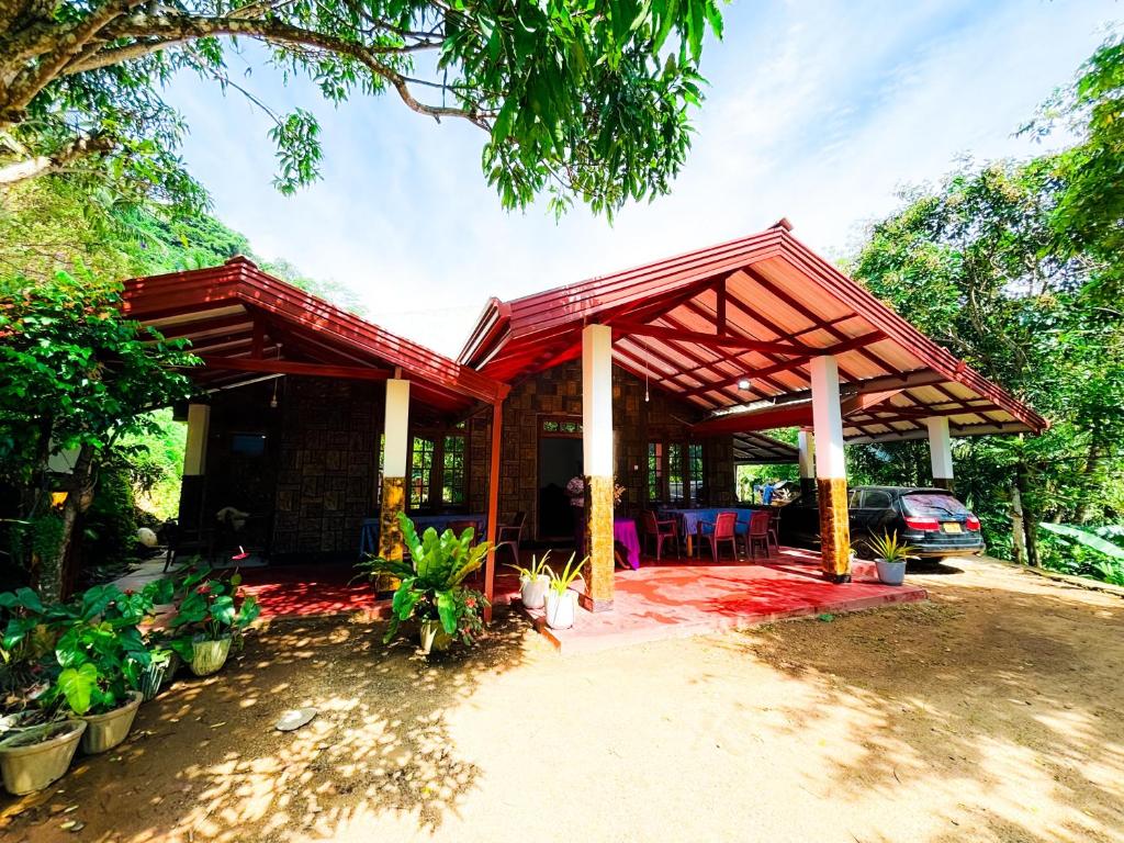 a house with a red roof at Knuckles bungalow in Rattota