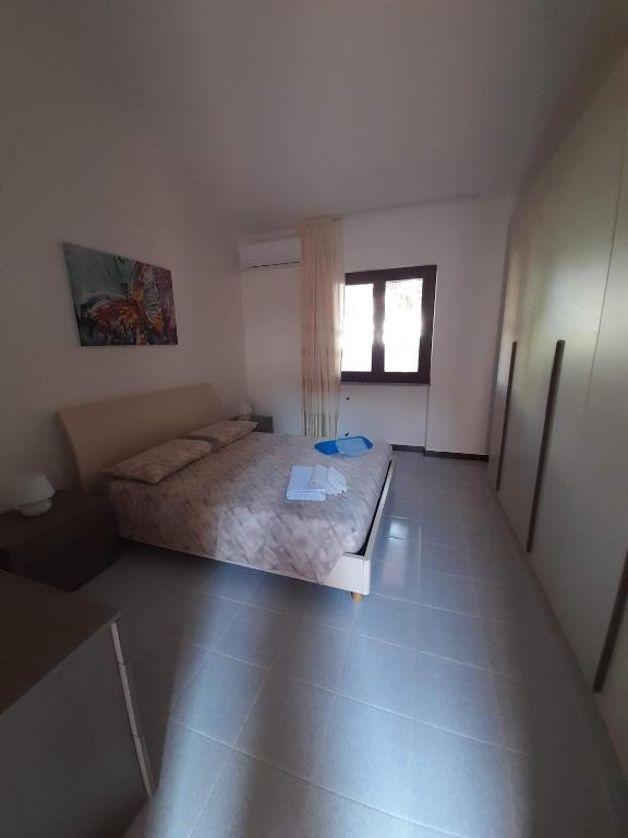 Łóżko lub łóżka w pokoju w obiekcie Casa Antonietta Villetta incantevole Vista Mare
