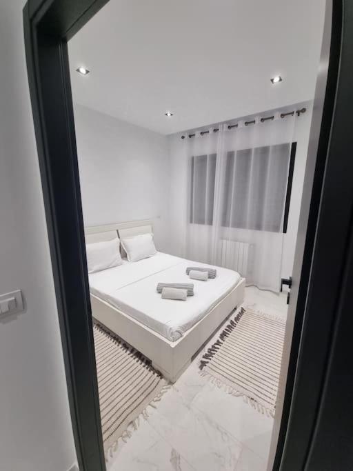 Postel nebo postele na pokoji v ubytování S+1 très haut standing avec piscine et fitness