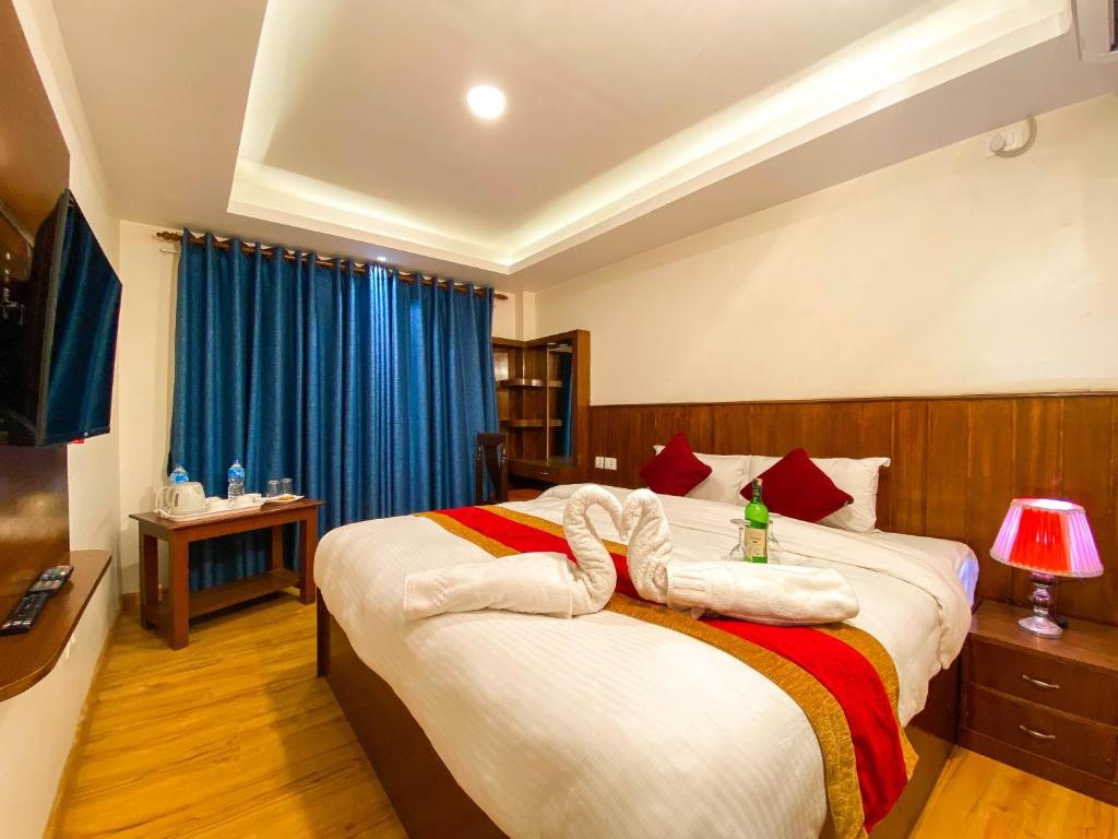 Postel nebo postele na pokoji v ubytování Hotel Abi International