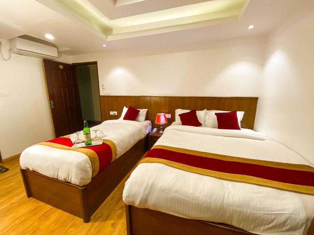 Postel nebo postele na pokoji v ubytování Hotel Abi International