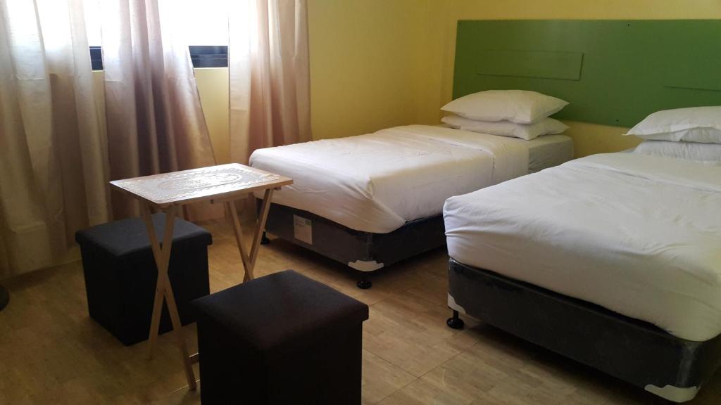 Postel nebo postele na pokoji v ubytování HOTEL BNL