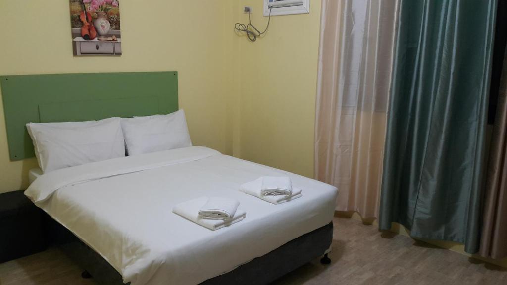 Postel nebo postele na pokoji v ubytování HOTEL BNL