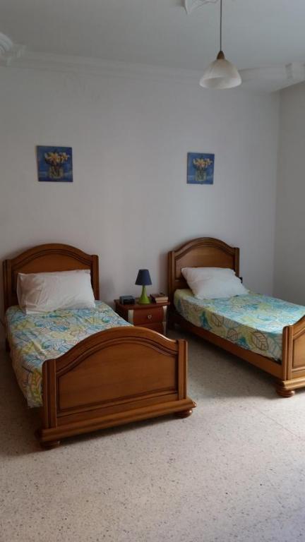 Postel nebo postele na pokoji v ubytování Villa Bougainvillier