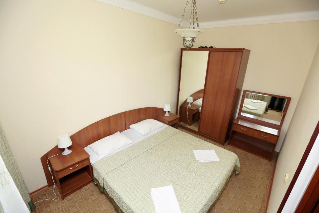 Кровать или кровати в номере Гостиница «Ак-гёль»