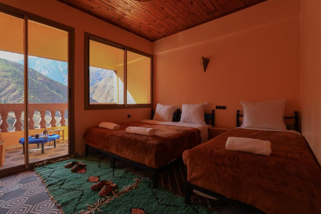 Postel nebo postele na pokoji v ubytování Tamatert Guest House