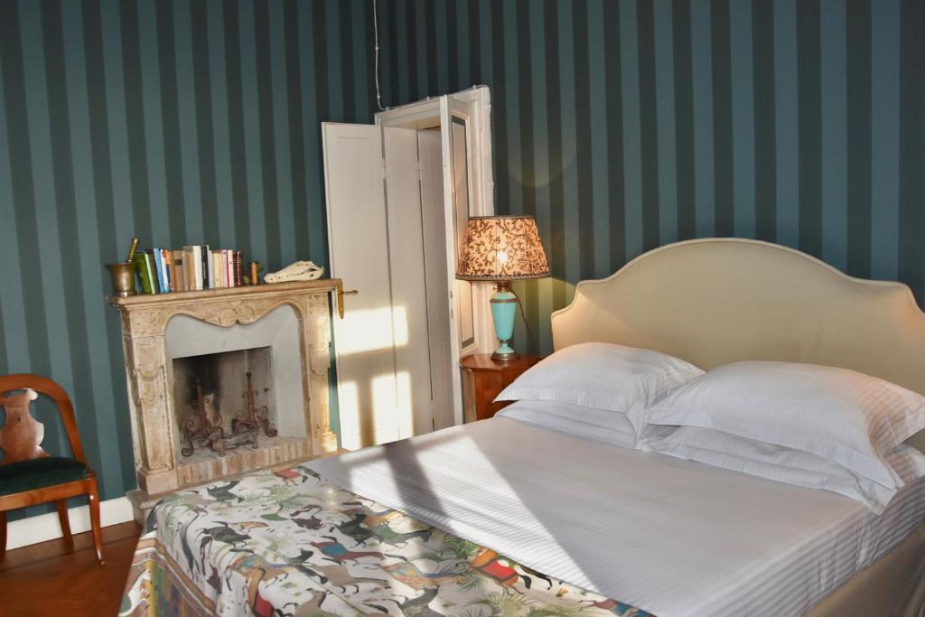 Postel nebo postele na pokoji v ubytování Relais Villino Rubini