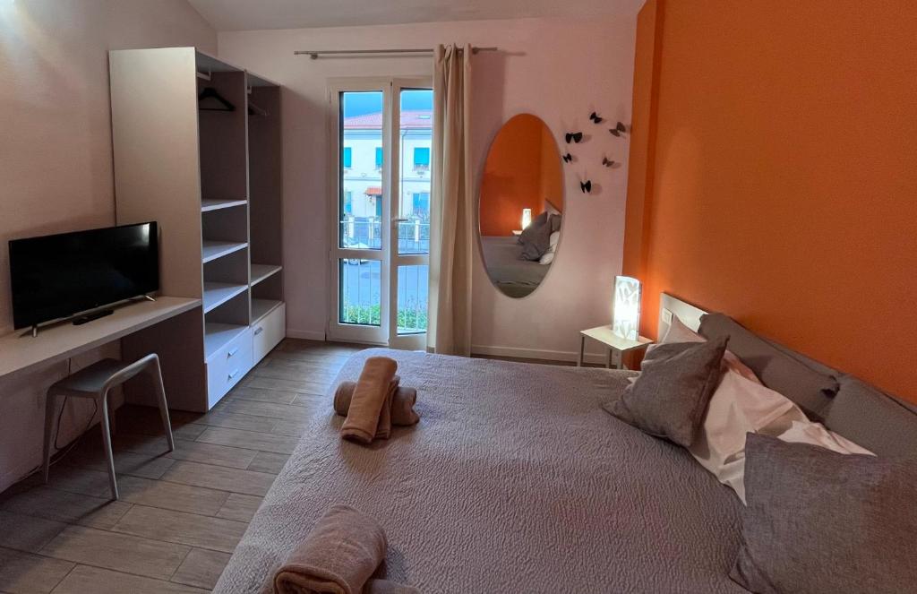 Postel nebo postele na pokoji v ubytování Vele Storiche Pisane