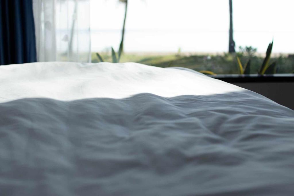Postel nebo postele na pokoji v ubytování บ้านระเบียงเลหลังสวน room B