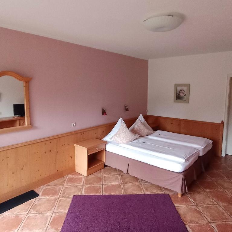 Postel nebo postele na pokoji v ubytování Hotel Farchauer Mühle