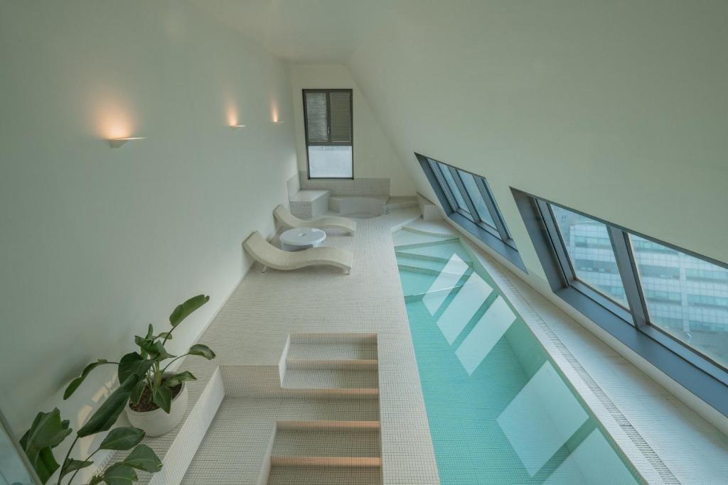 a staircase in a building with a glass floor at Gangnam Boutique Hotel Sohsul in Seoul