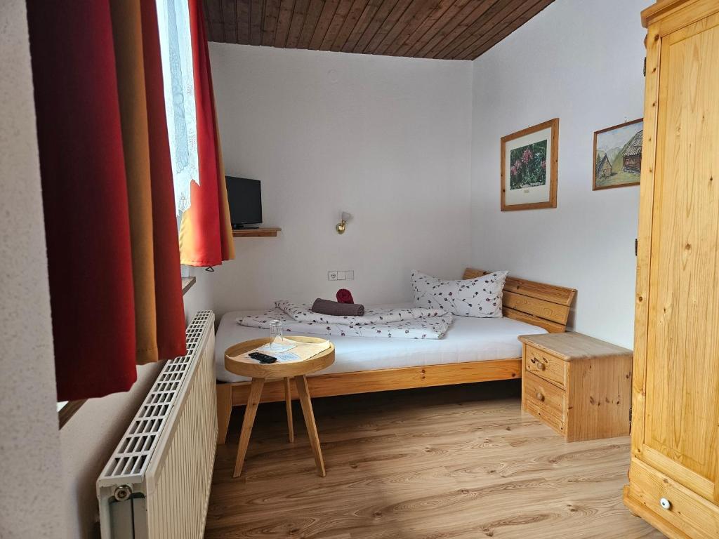 Postel nebo postele na pokoji v ubytování Gasthof Pension Kohlplatzl
