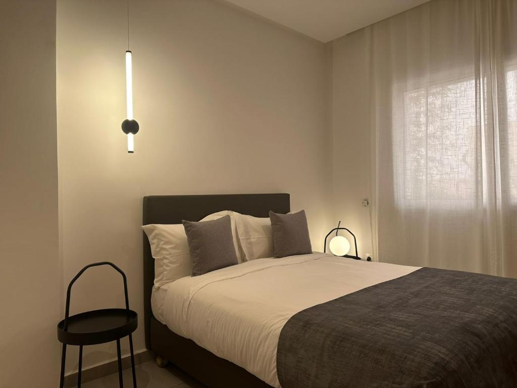 Postel nebo postele na pokoji v ubytování Residence Neya Harhoura