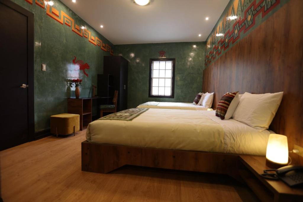 Postel nebo postele na pokoji v ubytování Chakana Hotel Boutique Mariscal