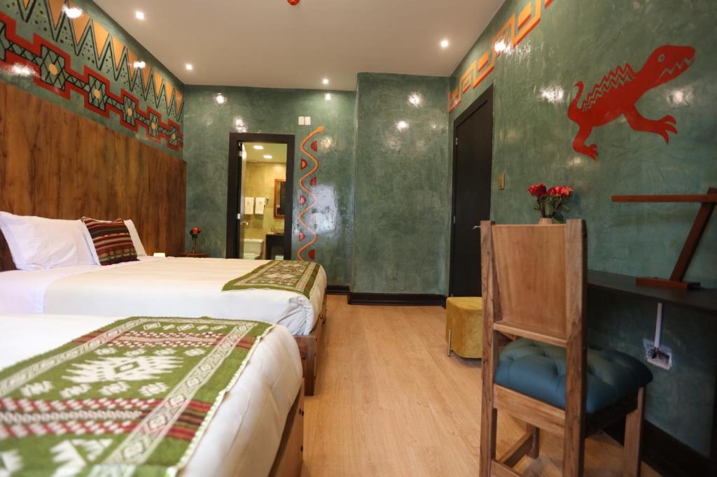 Postel nebo postele na pokoji v ubytování Chakana Hotel Boutique Mariscal
